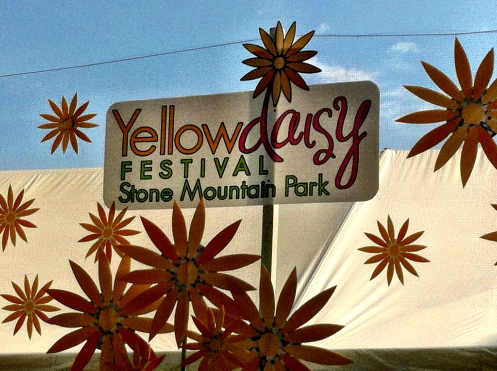 Banner sign that reads Yellow Daisy Festival at Stone Mountain Park